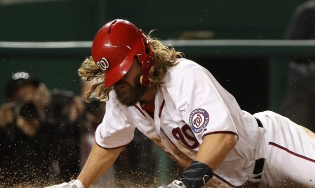 WASHINGTON, DC - OCTOBER 12: Jayson Werth #28 of the Washington Nationals slides safelt into home a...