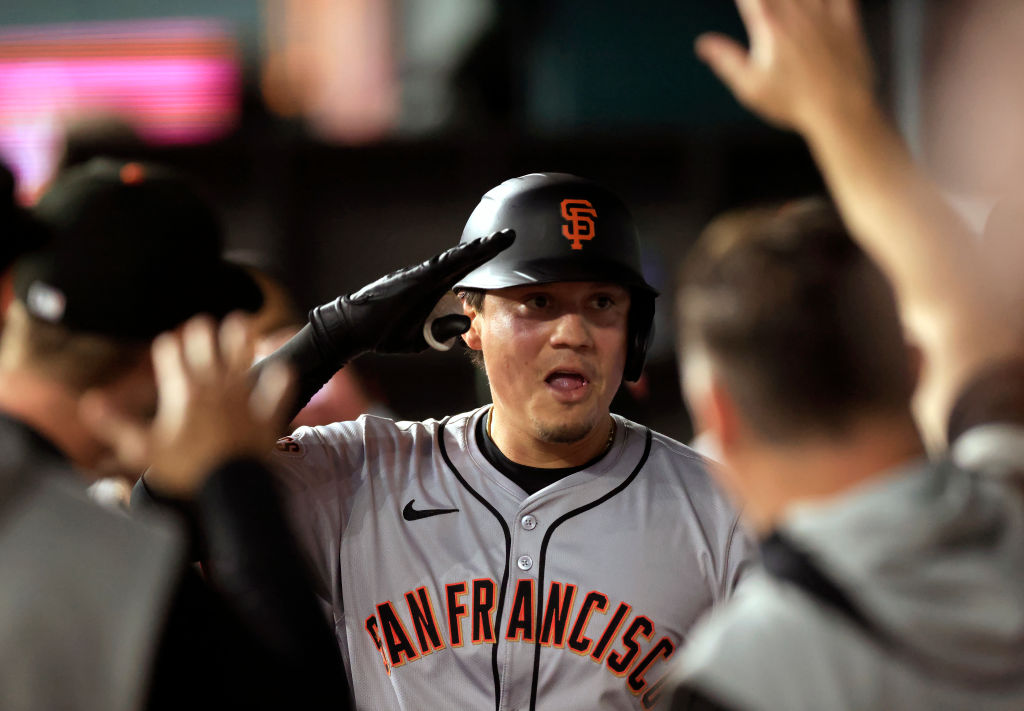 ARLINGTON, TX - JUNE 7: Wilmer Flores #41 of the San Francisco Giants celebrates with teammates aft...