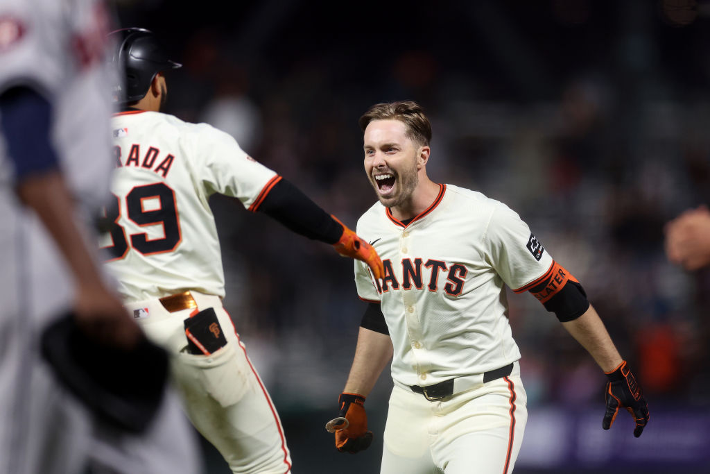 SAN FRANCISCO, CALIFORNIA - JUNE 10: Austin Slater #13 of the San Francisco Giants is congratulated...