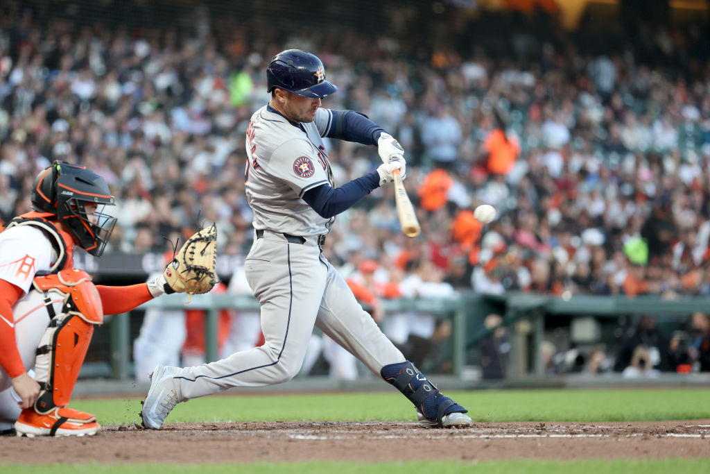 SAN FRANCISCO, CALIFORNIA - JUNE 11: Alex Bregman #2 of the Houston Astros hits an infield single a...