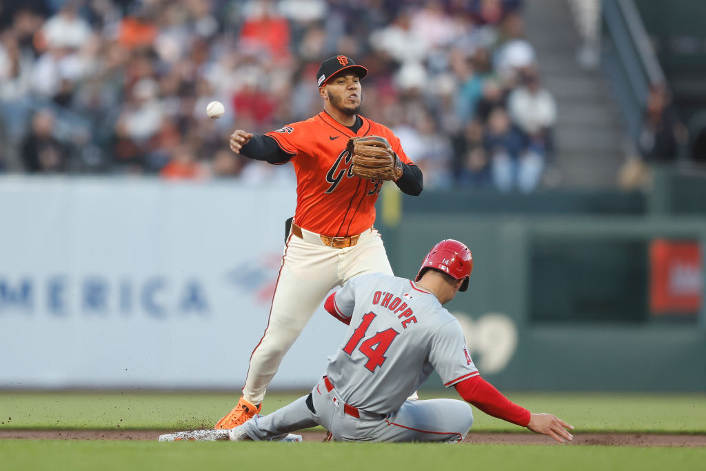 SAN FRANCISCO, CALIFORNIA - JUNE 14: Thairo Estrada #39 of the San Francisco Giants gets the out at...