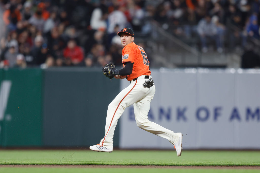 SAN FRANCISCO, CALIFORNIA - JUNE 14: Nick Ahmed #16 of the San Francisco Giants fields the ball and...